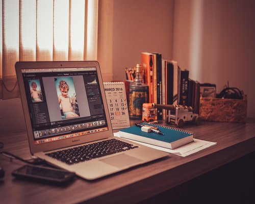 Woman taking a break looking away from laptop screen